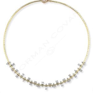 A gold necklace with a diamond cluster design.