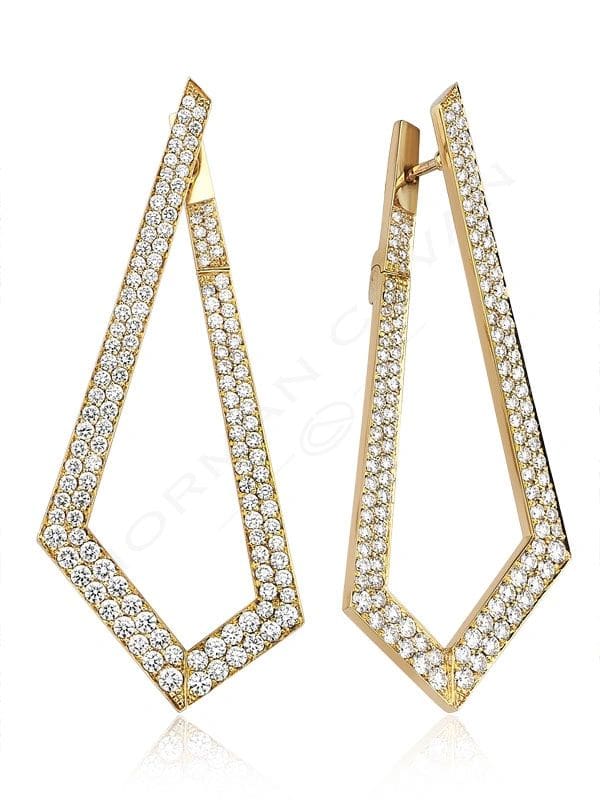 A pair of gold earrings with diamonds on them.