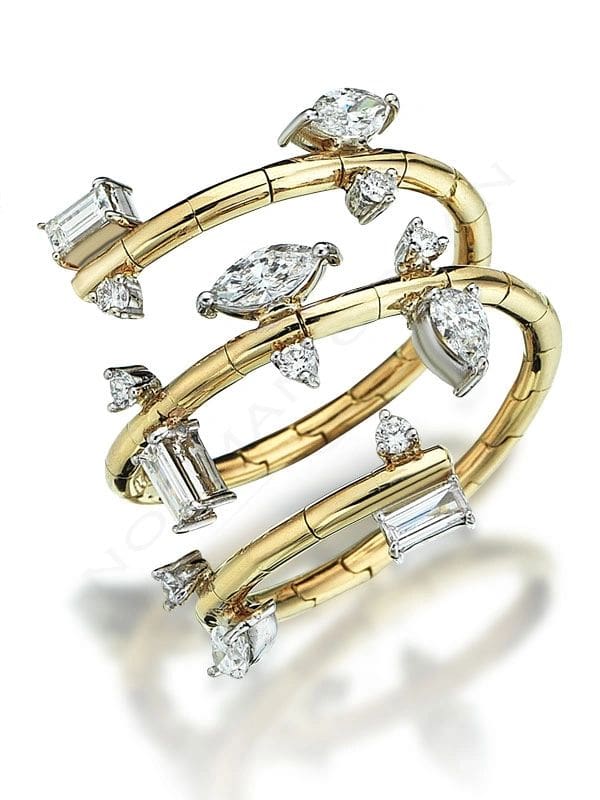 A gold and diamond ring with two rows of diamonds.