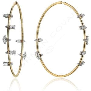 A pair of gold and diamond hoop earrings.