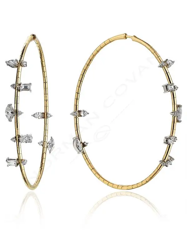 A pair of gold and diamond hoop earrings.