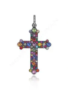 A colorful cross with many small stones on it