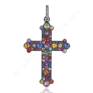 A colorful cross with many small stones on it