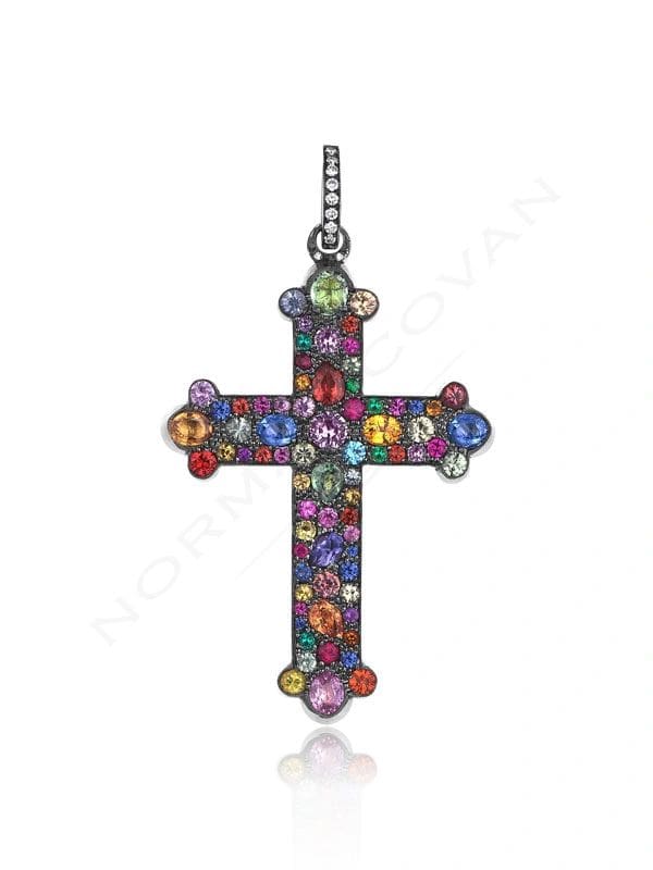 A colorful cross with many small stones on it