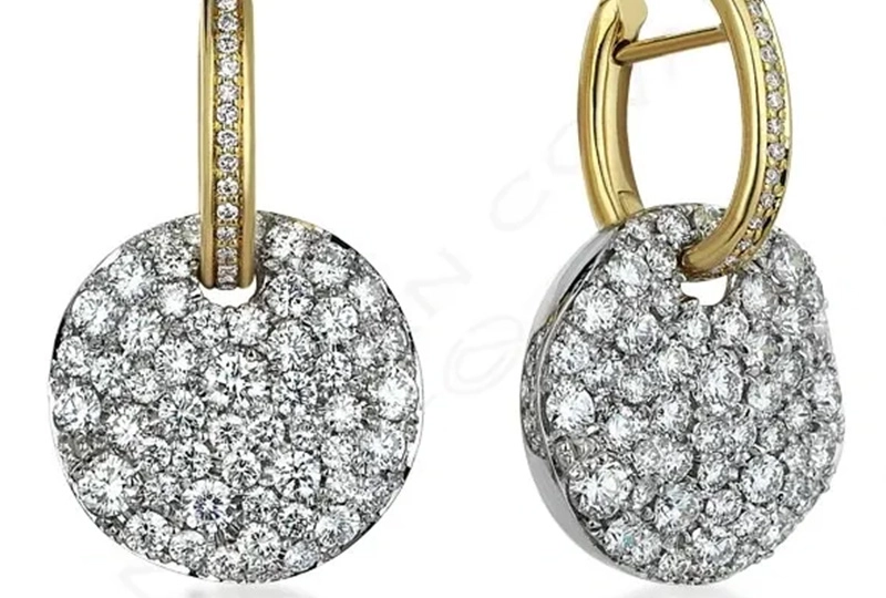 A pair of earrings with diamonds on them.