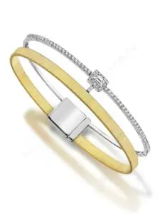 A yellow and white gold bracelet with diamonds.