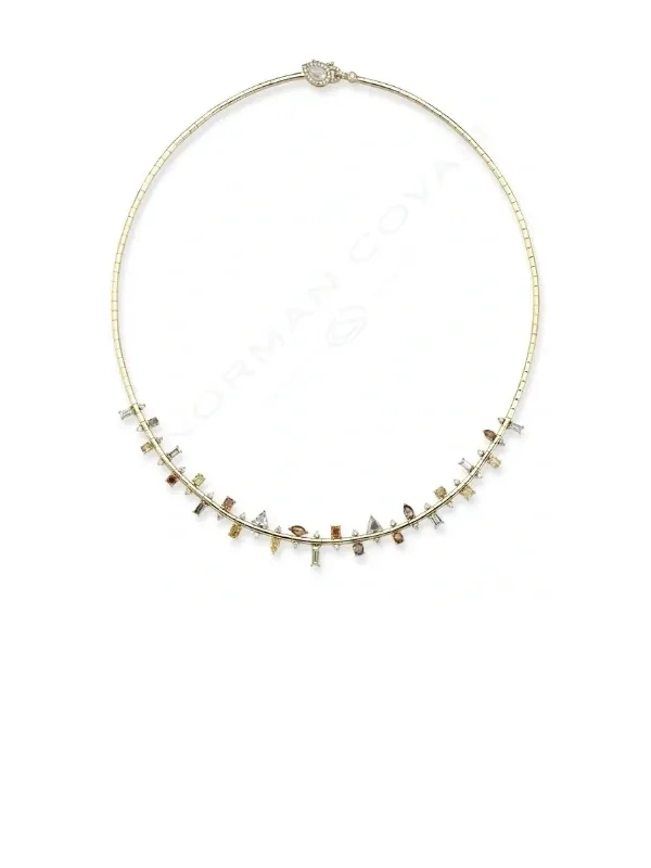 A necklace with a chain of gold and white stones.